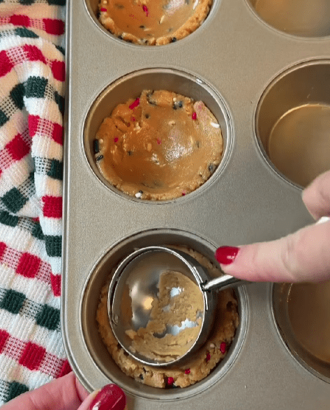 Step 1.1: Prepare peanut butter cookie mix according to the package instructions and press the dough into a regular-size muffin tin