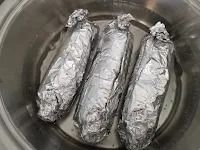 Step 1.1: Heat water in a pot, place the chicken packets in the pot, and simmer on low heat for 20 minutes