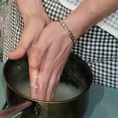 Step 1.1: Place sushi rice in a medium pot and run water over it