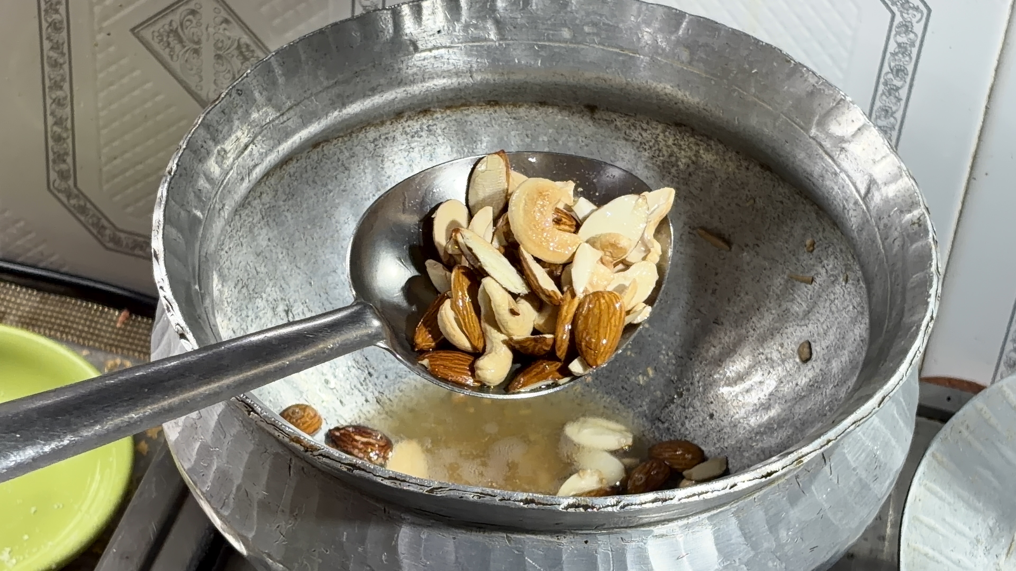 Step 1.1: Add the sliced nuts and roast until lightly golden and fragrant