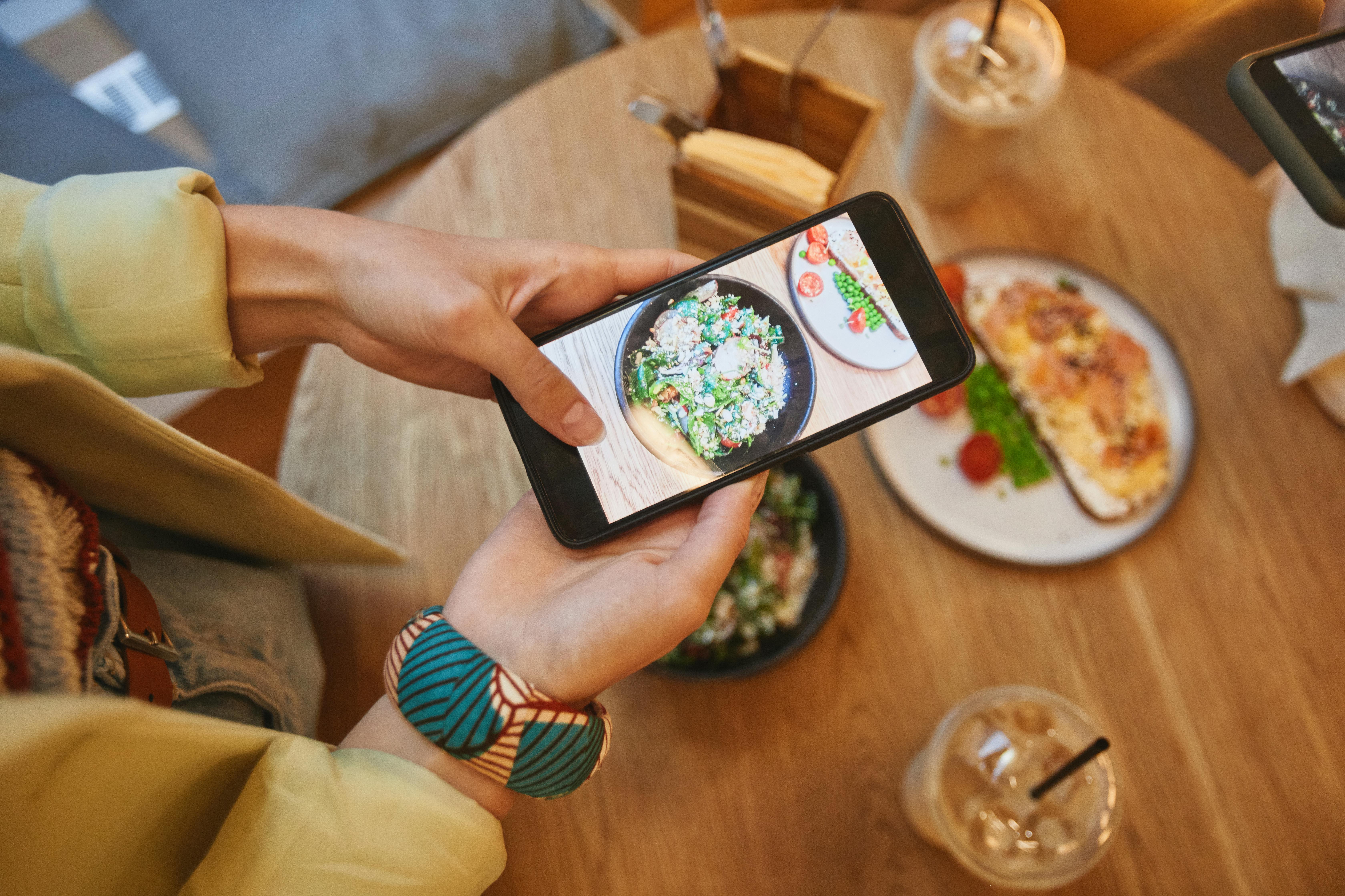 a person clicking a meal pictu