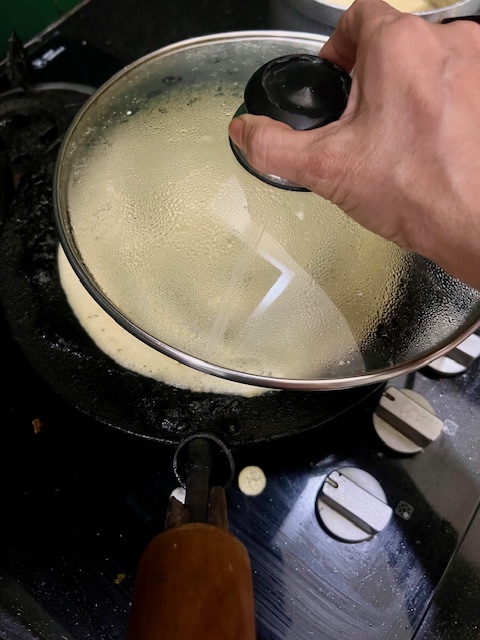 Step 3.1: cover and cook for a few minutes till the raw batter appears to set a bit