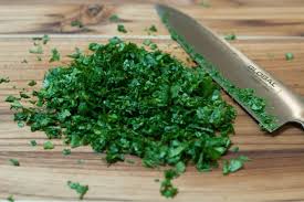 Step 2.1: Add cilantro and frozen fish directly to the tagine