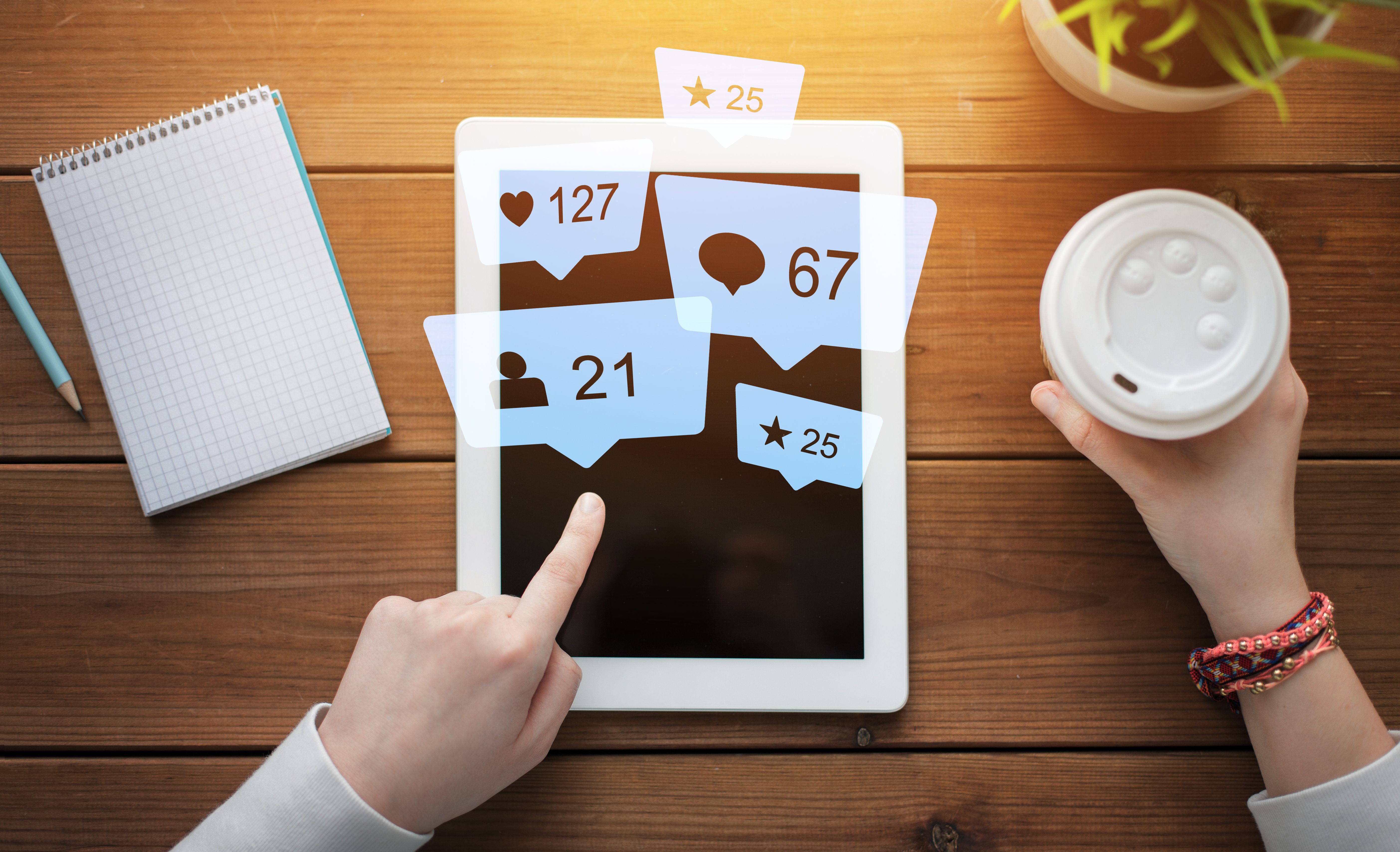 close-up-hands-with-virtual-icons-tablet-pc