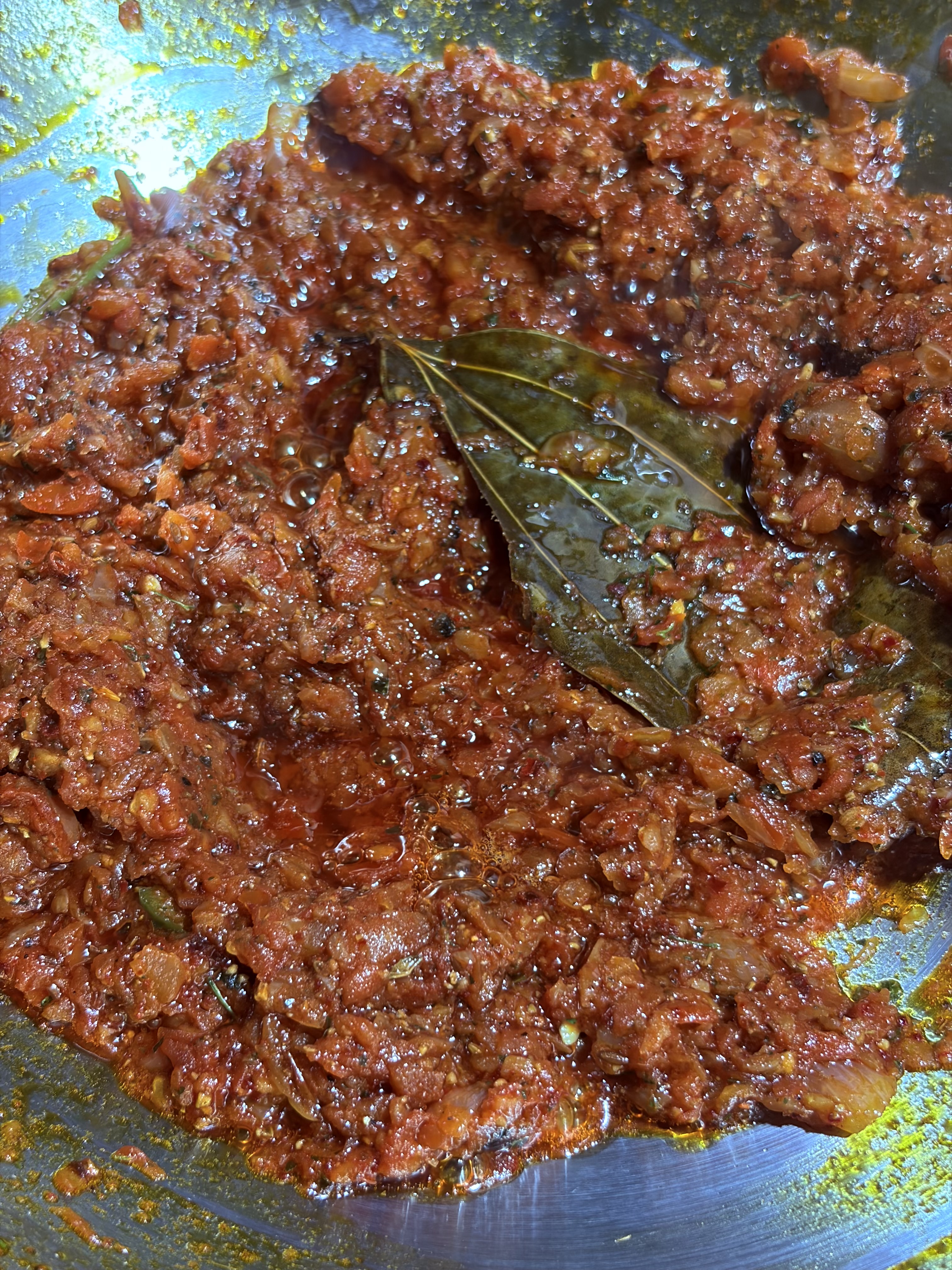 Step 4.1: Lower the heat and add turmeric, Kashmiri chilli powder, salt, kasuri methi, the remaining kadhai masala, and hot water