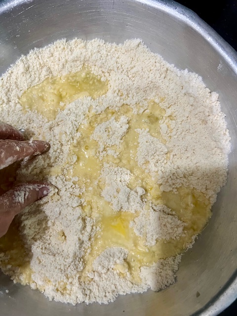 Step 1.2: Beat the egg with ice-cold water and add to the flour mixture