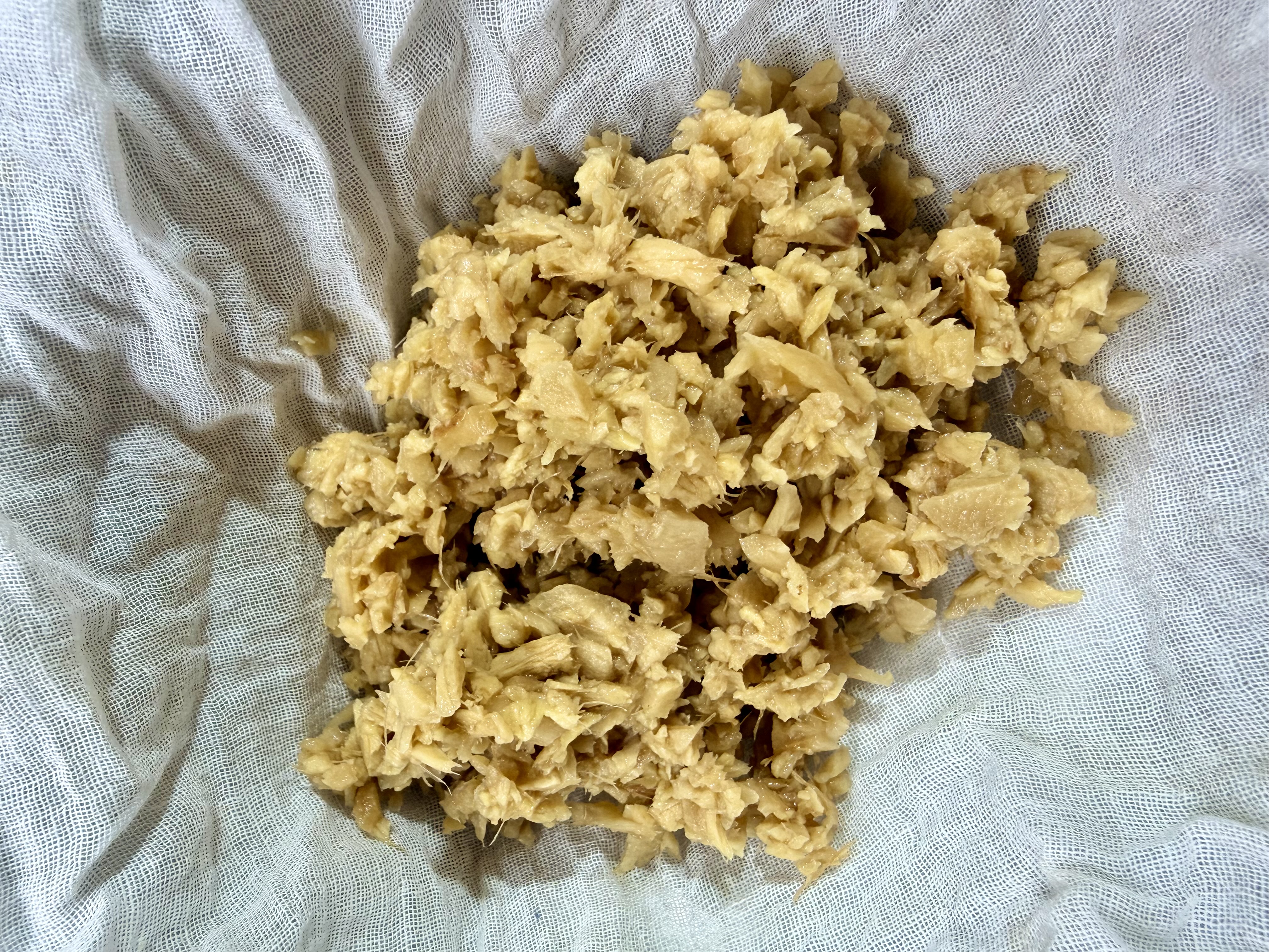 Step 1.1: Wash, peel, and finely grate the ginger