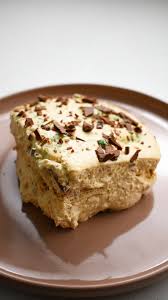 Step 1.1: Repeat the process with another layer of biscuits, grated peppermint crisp, and the remaining Ideal milk mixture