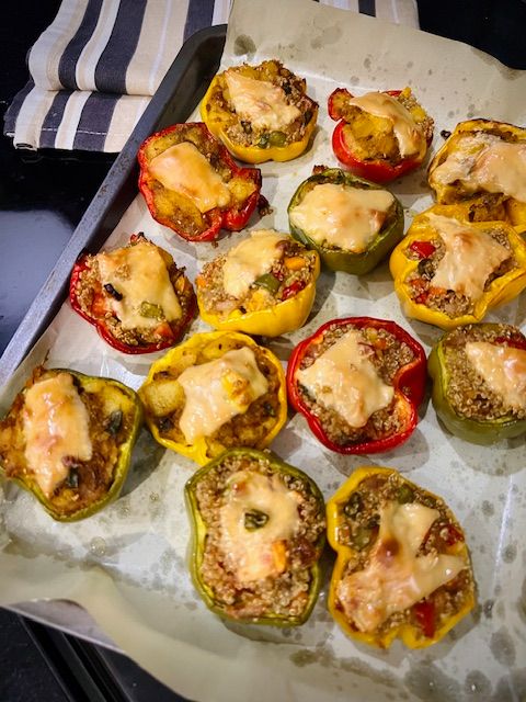 Step 6.2: With 5 minutes of baking left, top each pepper with a cheese slice piece