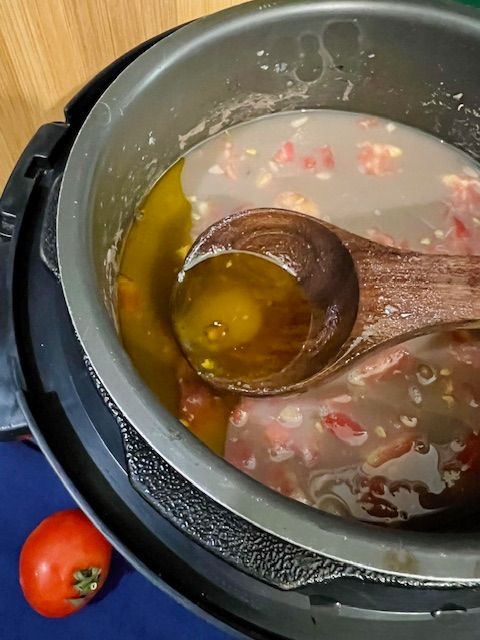 Step 2.1: Add the chopped tomato and mustard oil and stir well