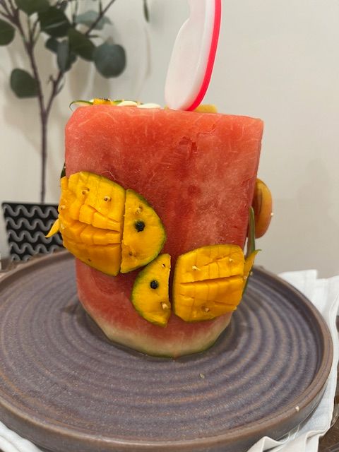Step 2.3: For the fish (mango): Slice off mango cheeks