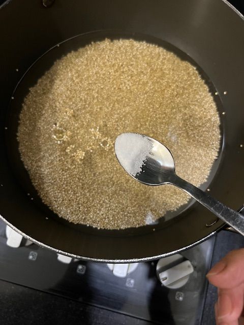 Step 1.1: Combine 1 cup of soaked quinoa, 2 cups of water, a pinch of salt, and a dash of oil (if using) in a medium saucepan or wok