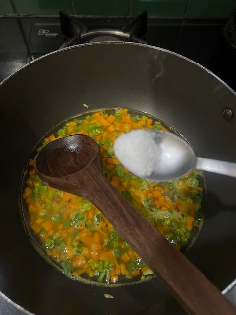 Step 4.1: Add boiled corn kernels (whole + puree if using), reserved corn water, and veggie stock