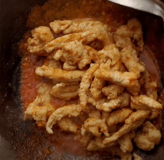 Step 2.2:  Finally, add plain yogurt and keep stirring until the sauce thickens slightly, giving the dish a rich and creamy texture typical of popular **Andhra chicken fry recipes**