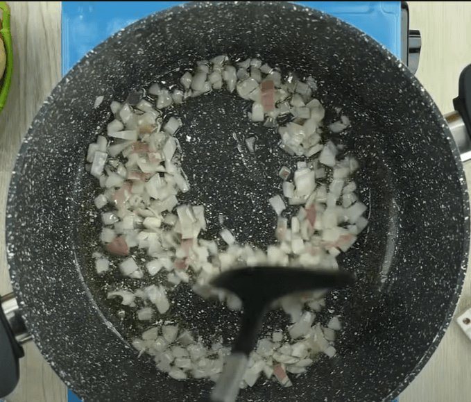 Step 1.1: In a pot, add cooking oil and onion