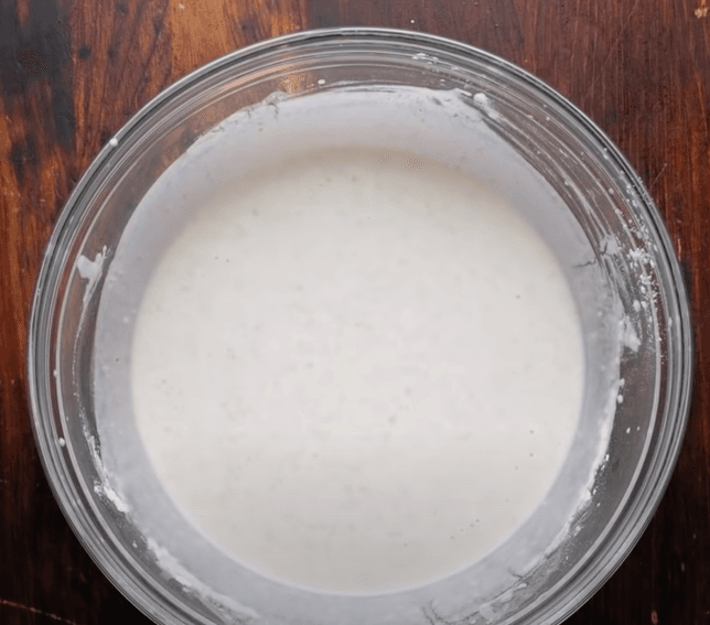 Step 2.1: In a bowl, mix all-purpose flour with corn flour, salt, and water
