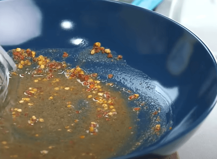 Step 1.1: In a bowl, add crushed red chilli, black pepper powder, pink salt, lemon juice, and mix well