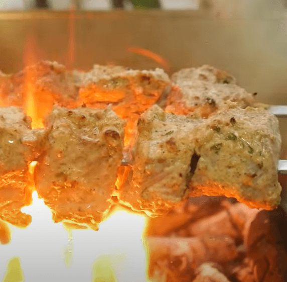 Step 1.1: Place the skewers on a BBQ grill over burning charcoal and grill from all sides until done, basting with oil