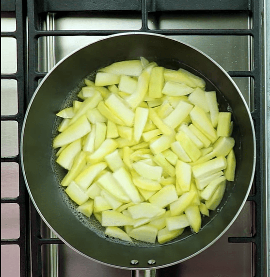 Step 1.1: Add water to a pan, add raw mangoes, cover the pan, and let it cook until fully tender