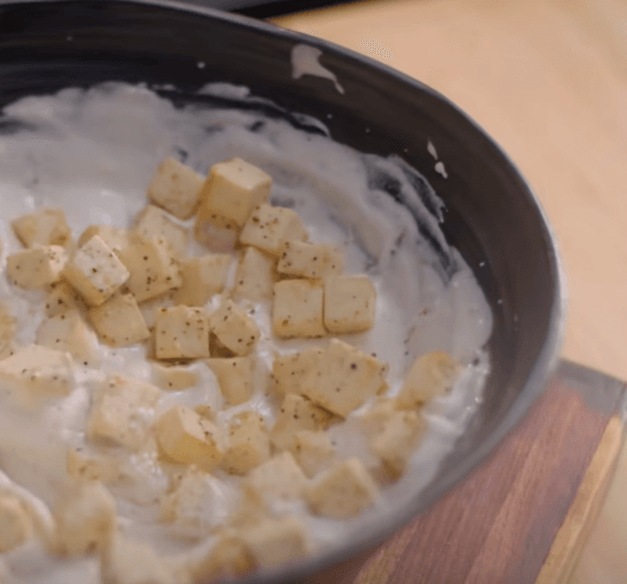 Step 1.2: Place a small bowl on the filling and place a piece of live charcoal in it