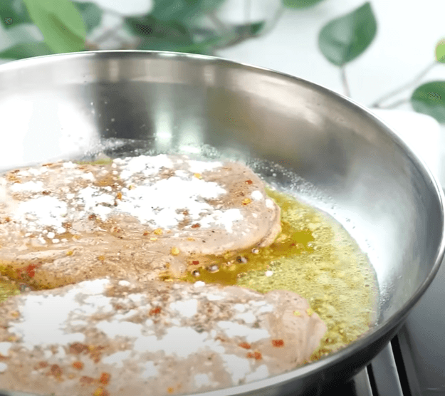 Step 1.1: Add marinated fillets and sprinkle all-purpose flour on both sides