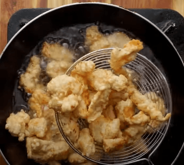 Step 1.1: Heat oil in a frying pan and shallow fry the marinated chicken strips for 4-5 minutes until they turn golden brown and crispy