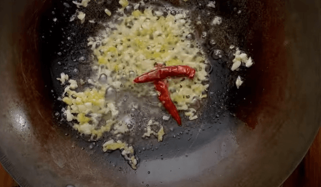 Step 2.1: In a wok or deep pan, heat cooking oil along with unsalted butter