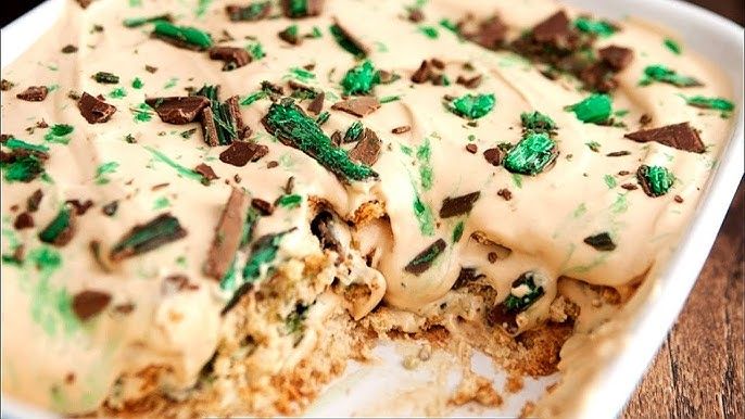 Step 1.1: Pour half of the Ideal milk mixture over the grated peppermint crisp
