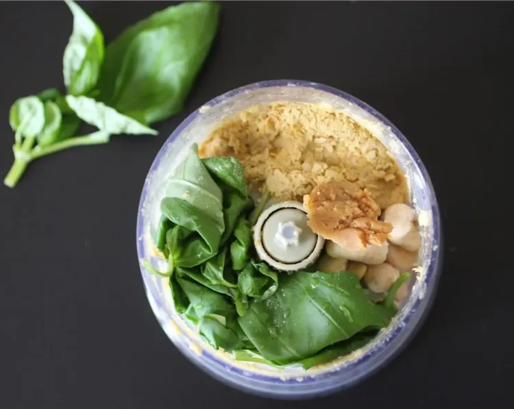 Step 1.1: Add fresh basil, drained cashews, garlic, nutritional yeast, white miso paste, warm water, lemon juice, and salt to a food processor