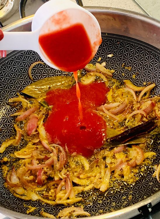 Step 1.1: Add tomato puree and cook for 2-3 minutes until it slightly thickens and the oil oozes out