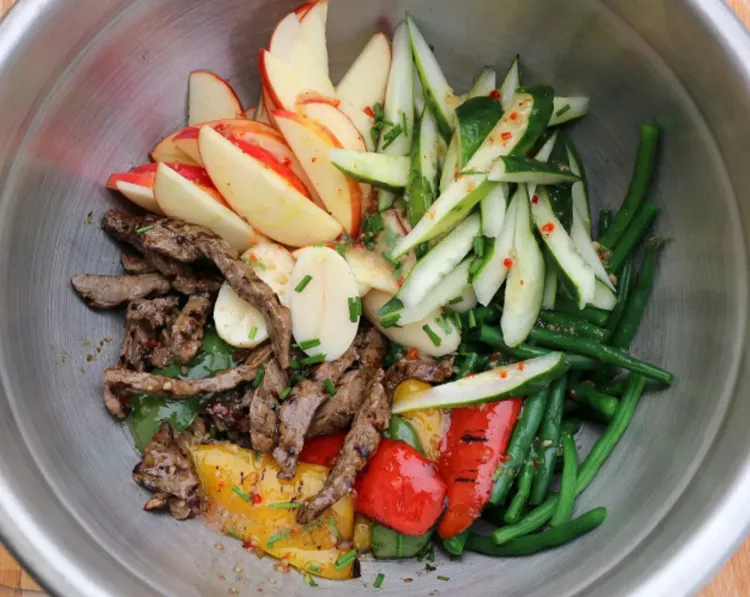 Step 3.1: Mix the steak, apple, peppers, beans, and cucumbers with the Raspberry Vinaigrette