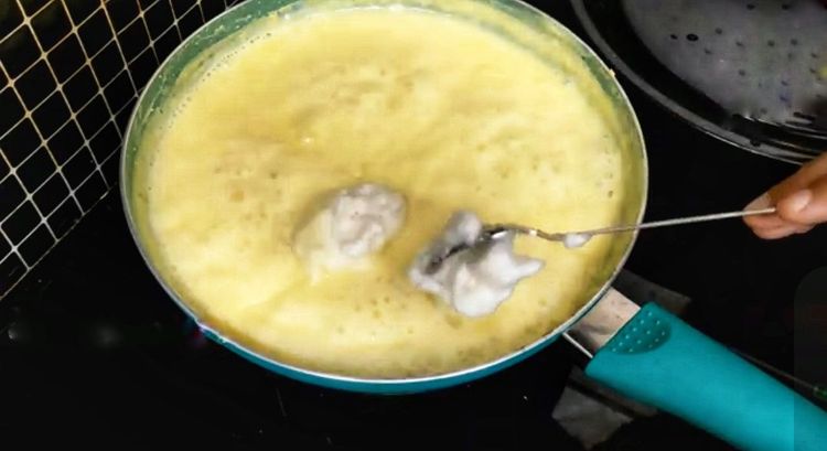 Step 3.1: Using a spoon, gently place scoops of meringue onto the custard