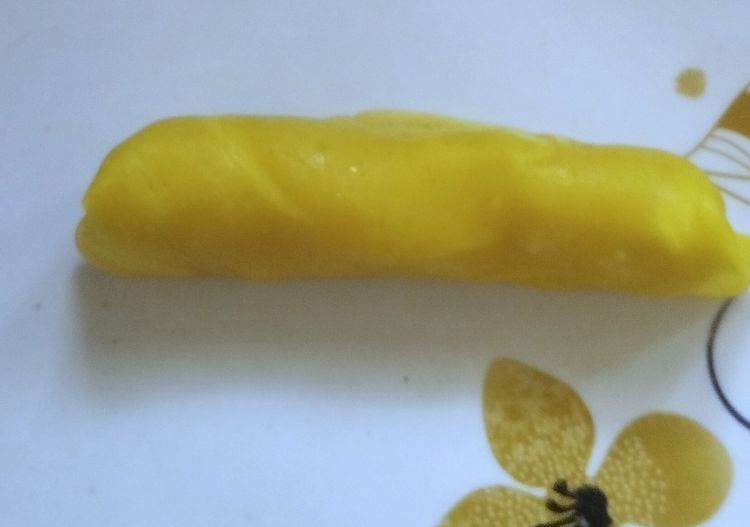 Step 4.3: Roll the crepe once, then fold the ends inward and continue rolling