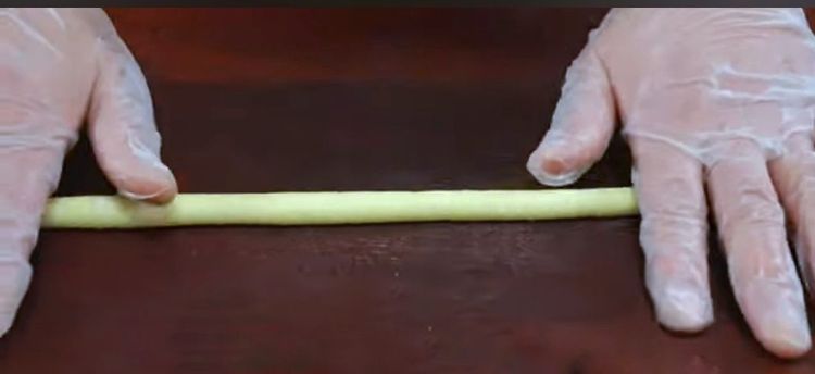 Step 1.1: Roll each piece of potato dough into long strands and set aside