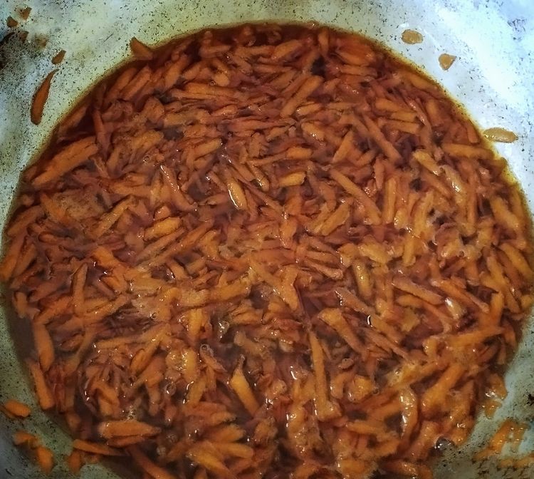 Step 1.1: Add grated carrot and raisins