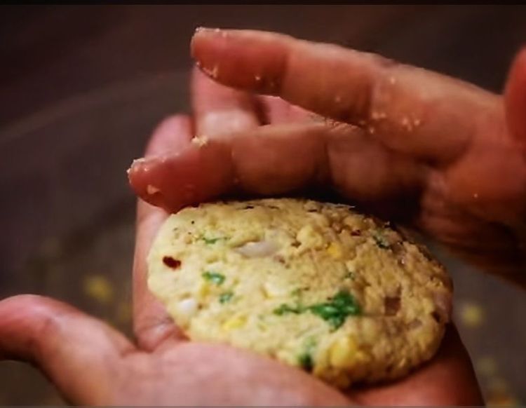 Step 4.2: Take a small portion from the batter, roll it with your hand, and gently flatten it with your palm (not too thick)
