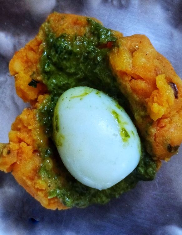Step 1.1: Take a small portion of the potato mix and stuff a quail egg inside with some green chutney