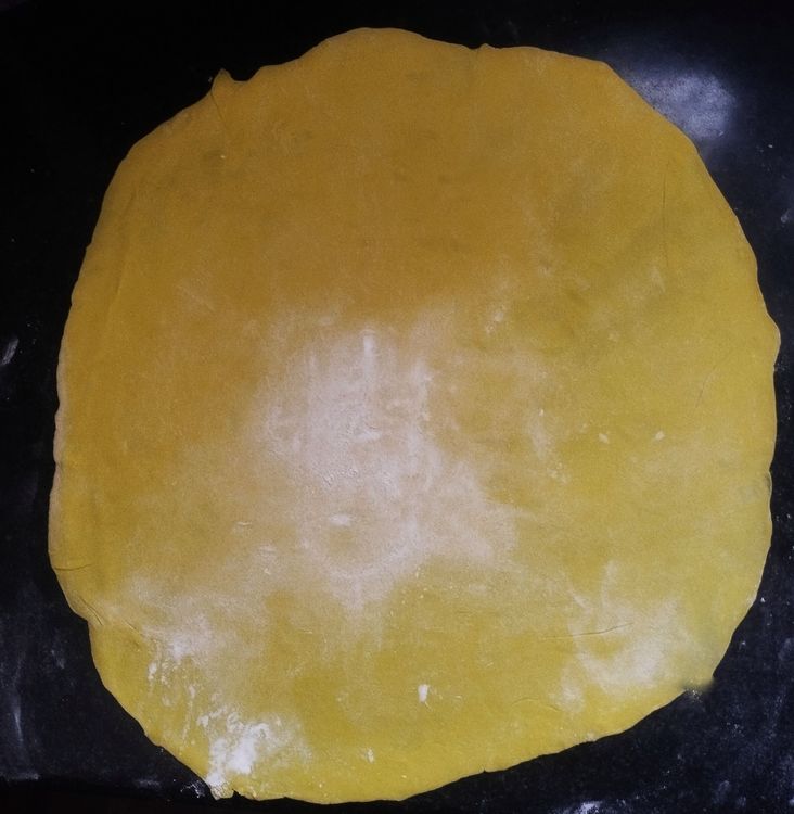 Step 2.2: Dust some flour on the rolling board and flatten the dough using a rolling pin to make a thin sheet
