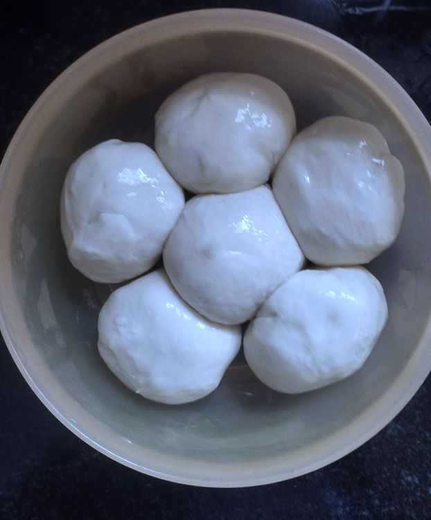 Step 2.1: Make big lemon-sized balls from the dough and grease them with the ghee-oil mix