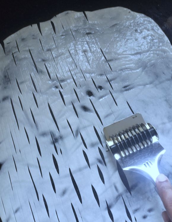 Step 2.1: Use a pasta cutter to cut into thin strips in a vertical motion