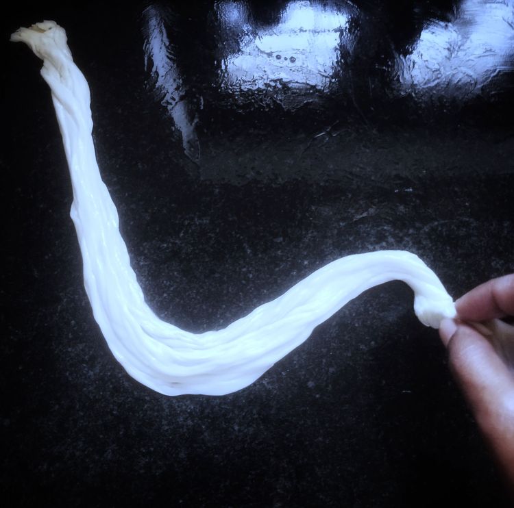 Step 2.1: Take the strips with your hand, pull slightly, and roll into a spiral
