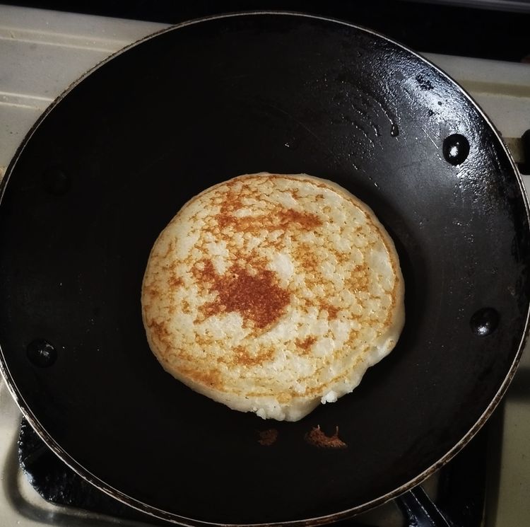 Step 1.1: Once the base of the dosa turns golden brown, flip it