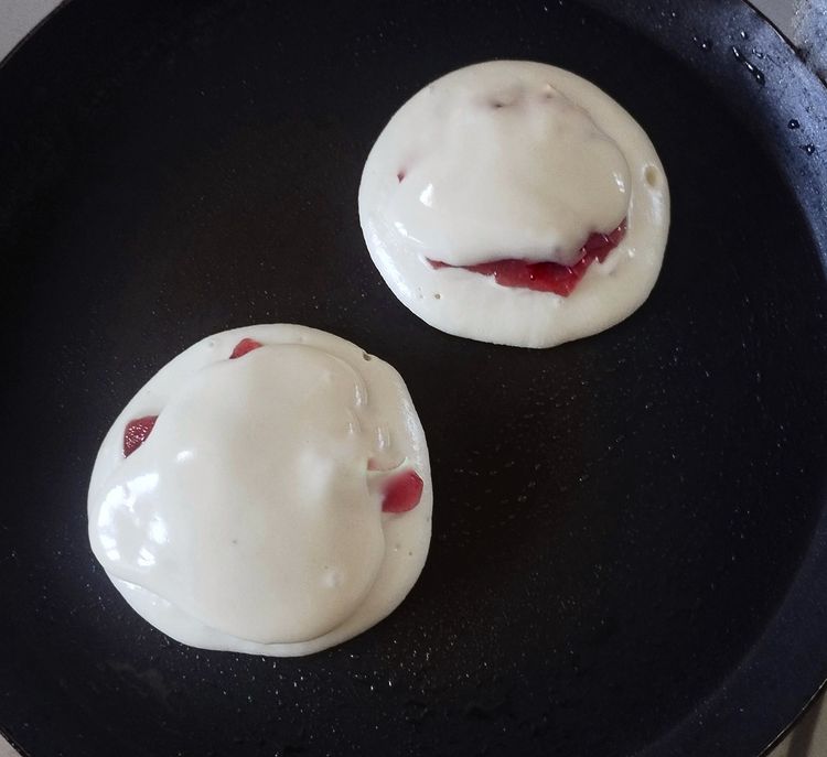 Step 2.1: Pour some batter over the jam