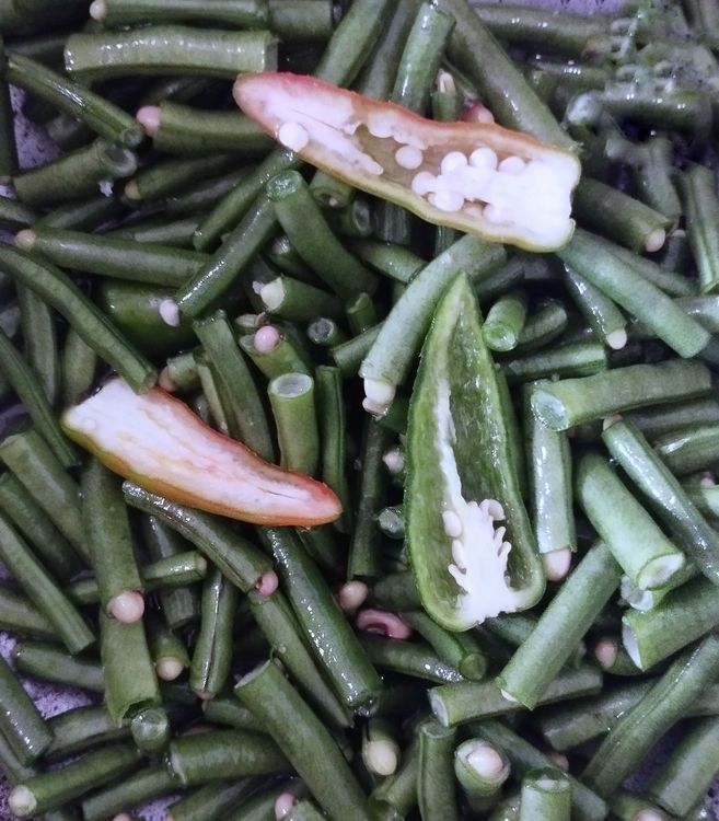 Step 2.1: Heat a pan and add cowpea beans, green chilli, salt, and water