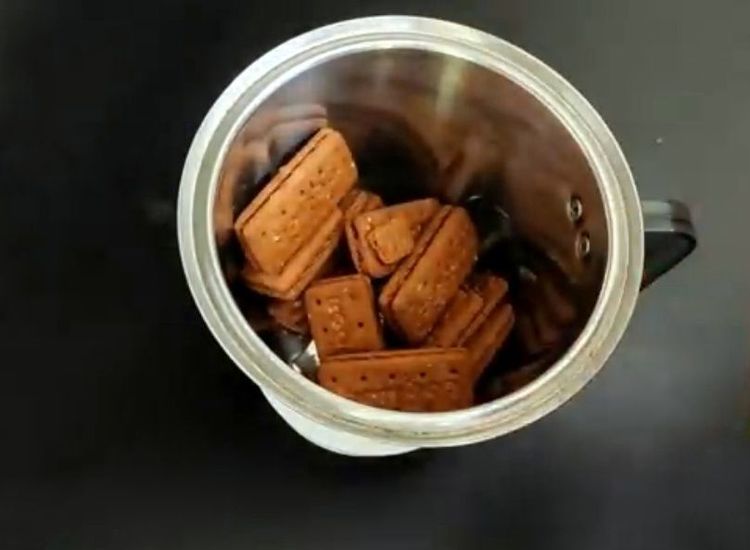 Step 1.1: Add Bourbon biscuits and Marie biscuits to a mixer jar and coarsely crush them