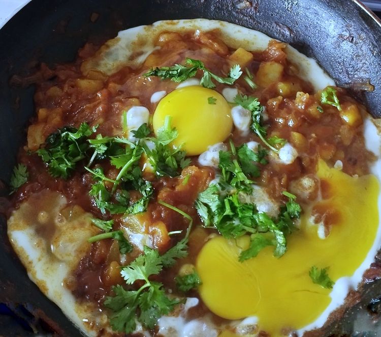 Step 1.1: Add tomato sauce and chilli sauce, then crack the eggs into the mixture