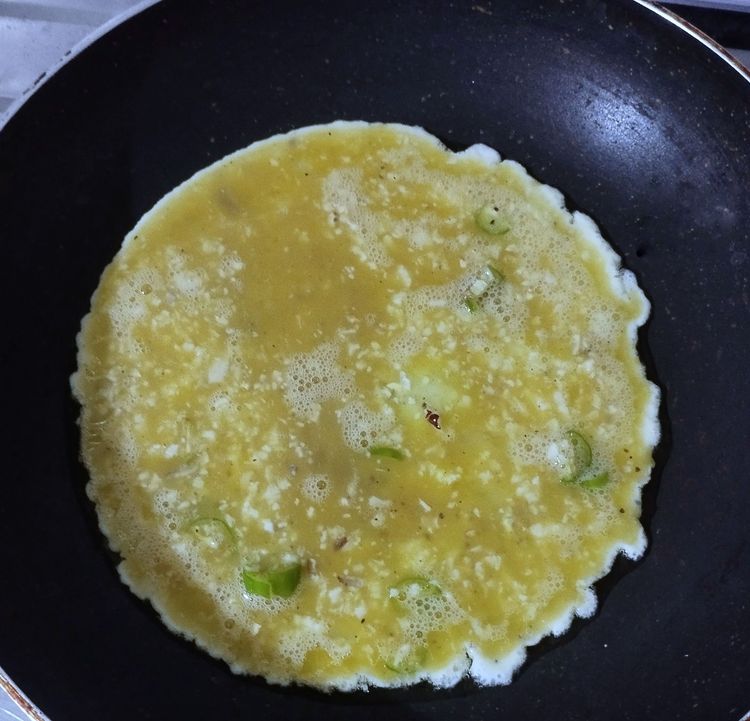 Step 1.1: Heat a pan, add oil, and pour in the egg mixture