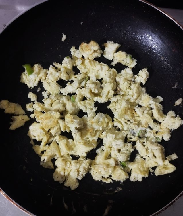 Step 1.2: Heat a pan, add oil, and pour in the egg mixture