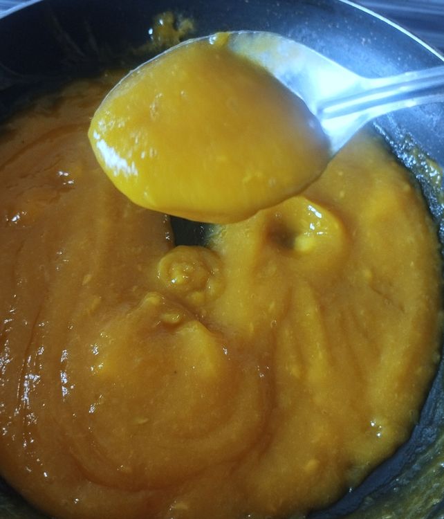 Step 1.1: Heat a pan and add the mango puree, 3 tbsp sugar, and water