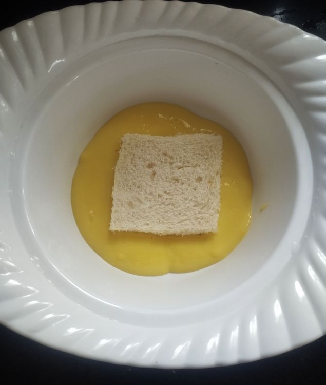 Step 1.2: To set the dessert, take a bowl and first add some custard milk
